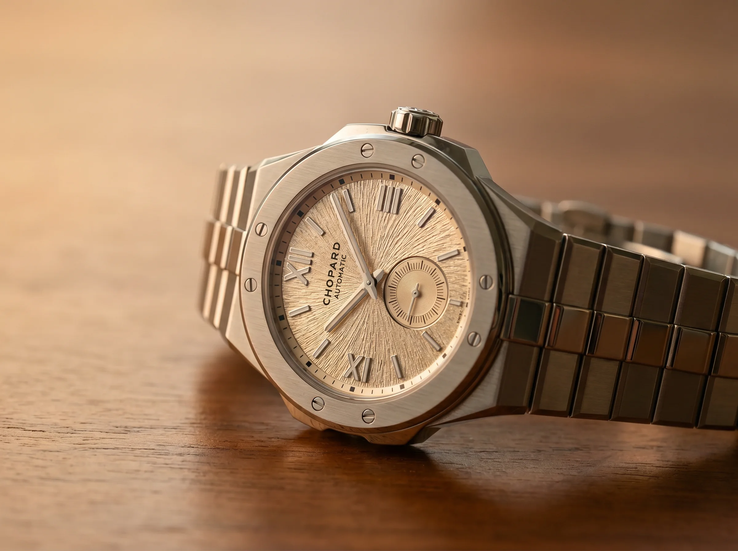 Close view of the Chopard Alpine Eagle's champagne Mountain Glow dial and small seconds subdial at 6 o'clock