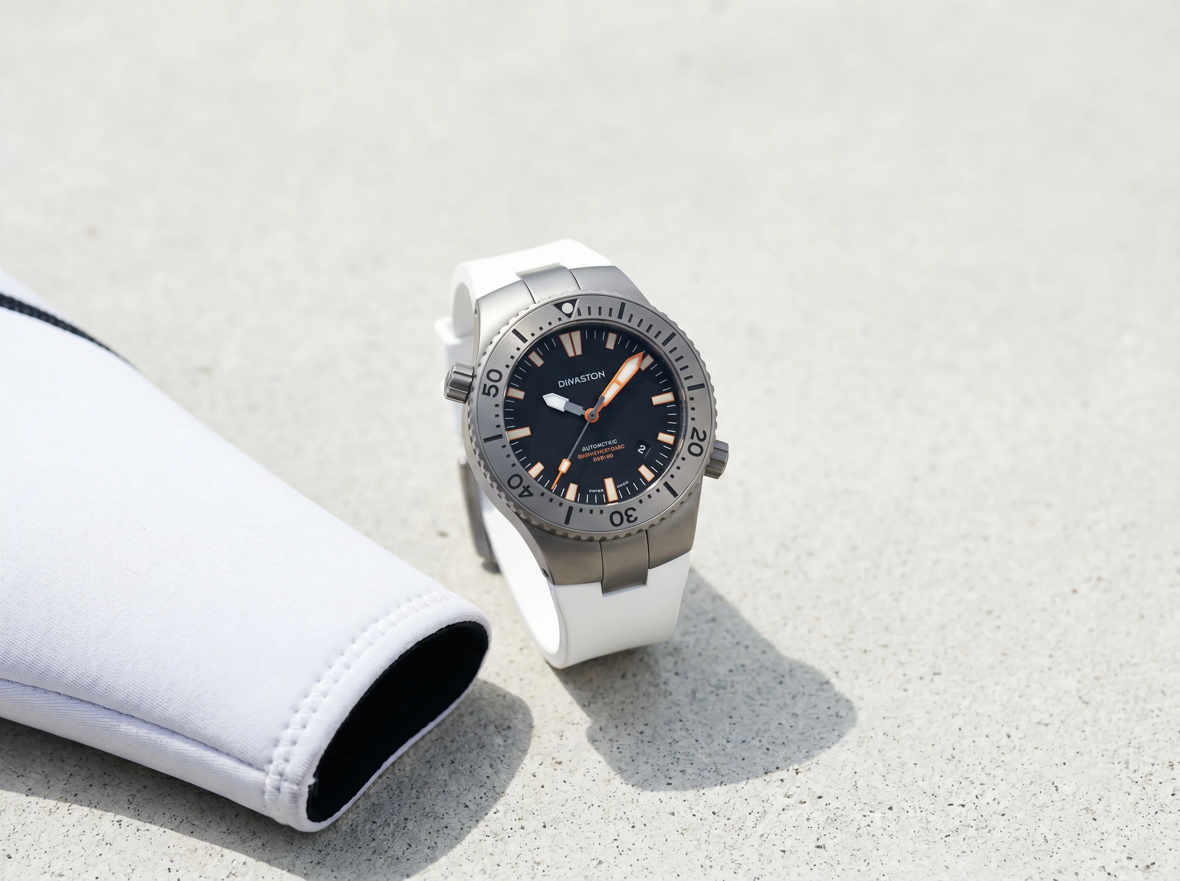 Blancpain Fifty Fathoms Tech in titanium with white rubber strap on pale concrete