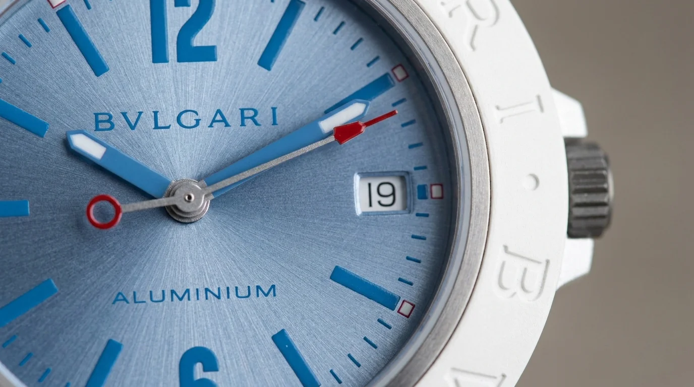 Macro shot of the Bulgari Bulgari Aluminium Ice Blue dial, reference 104309, showing the sun-brushed finish and red-tipped seconds hand