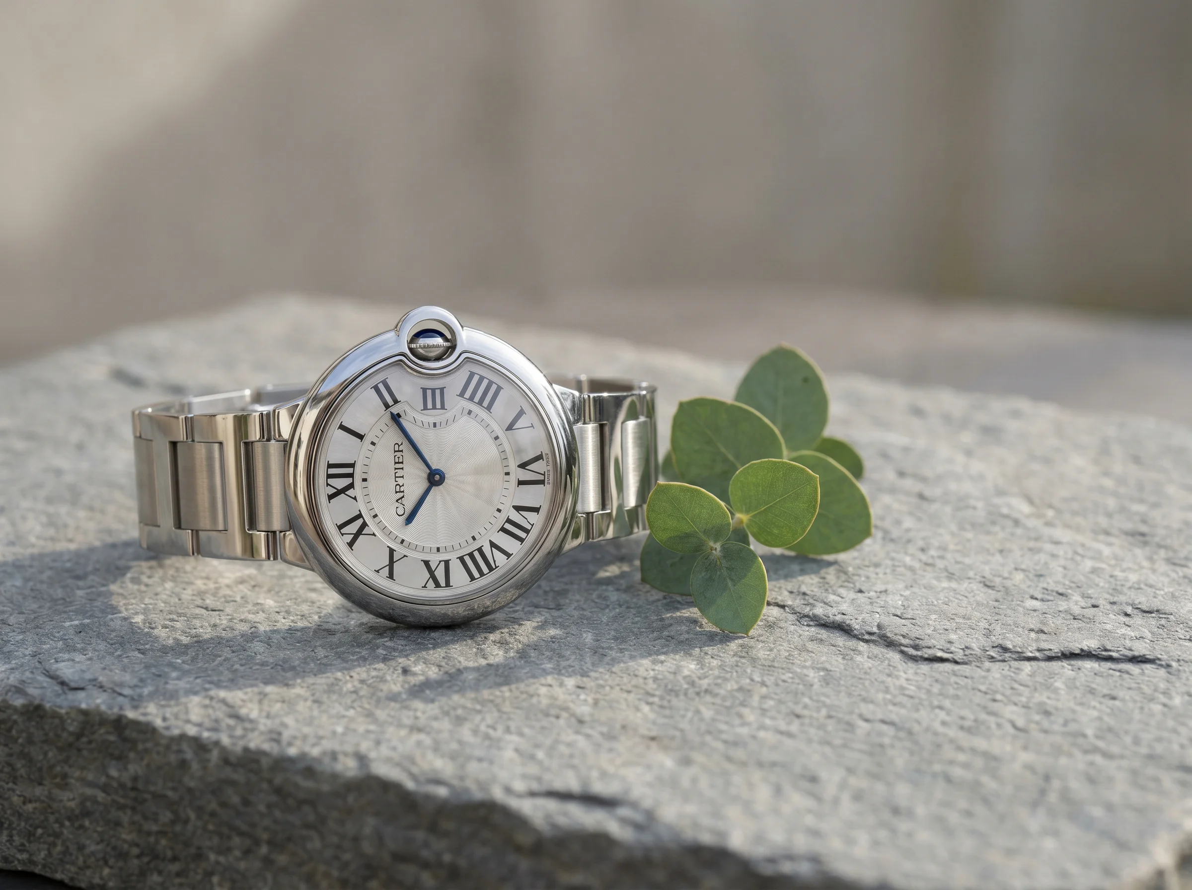 Cartier Ballon Bleu side profile showing the rounded pebble case and cabochon crown under its arc