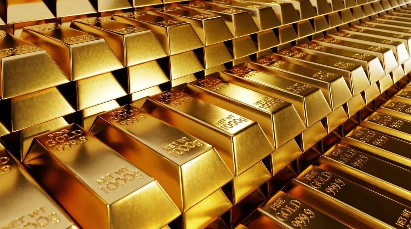 Stack of gold bullion bars, the rising gold price cited as the driver behind Rolex's June 2026 gold-only price increase.