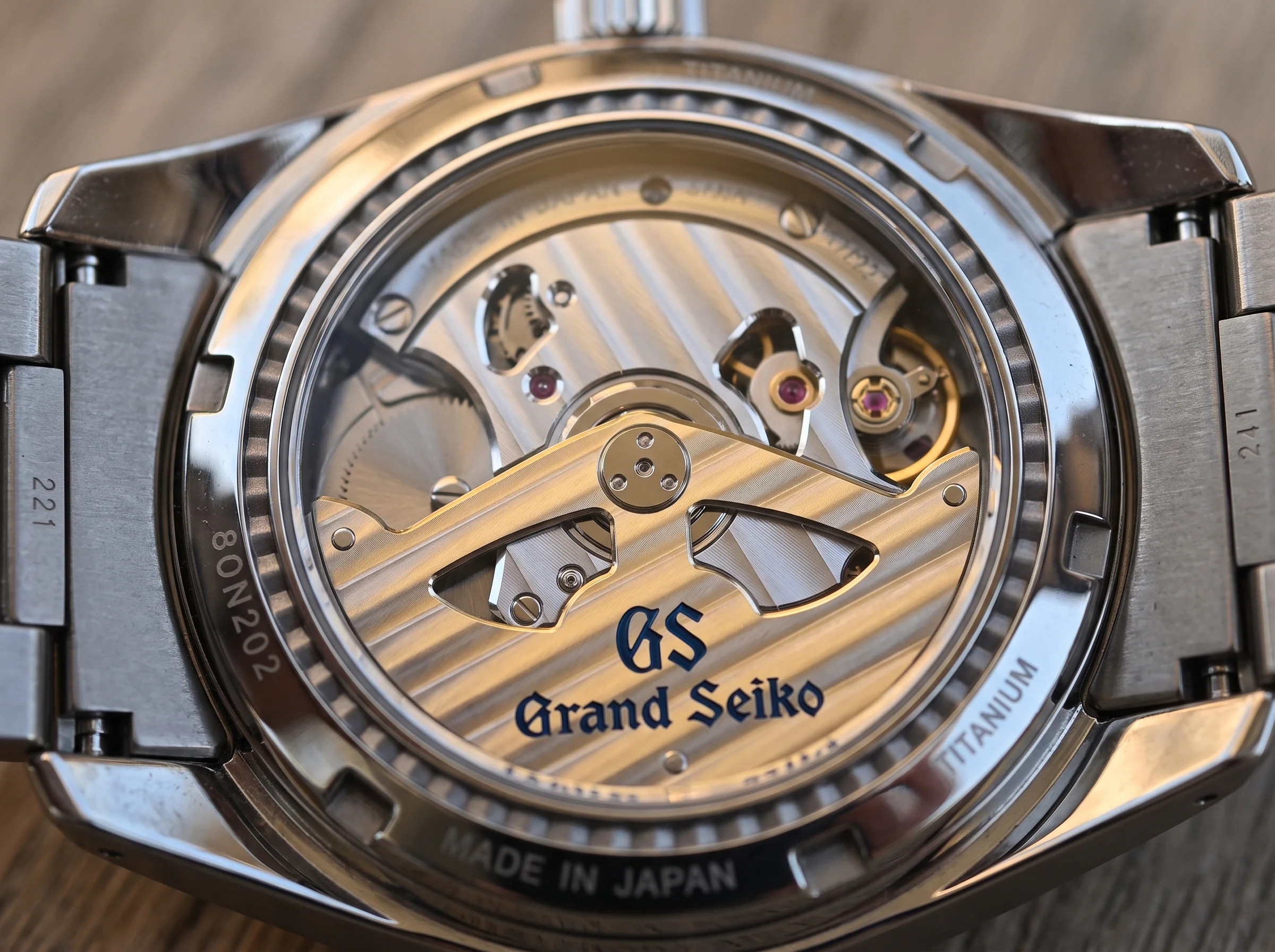 Finely finished Grand Seiko Spring Drive movement with decorated bridges and jewels seen through the caseback