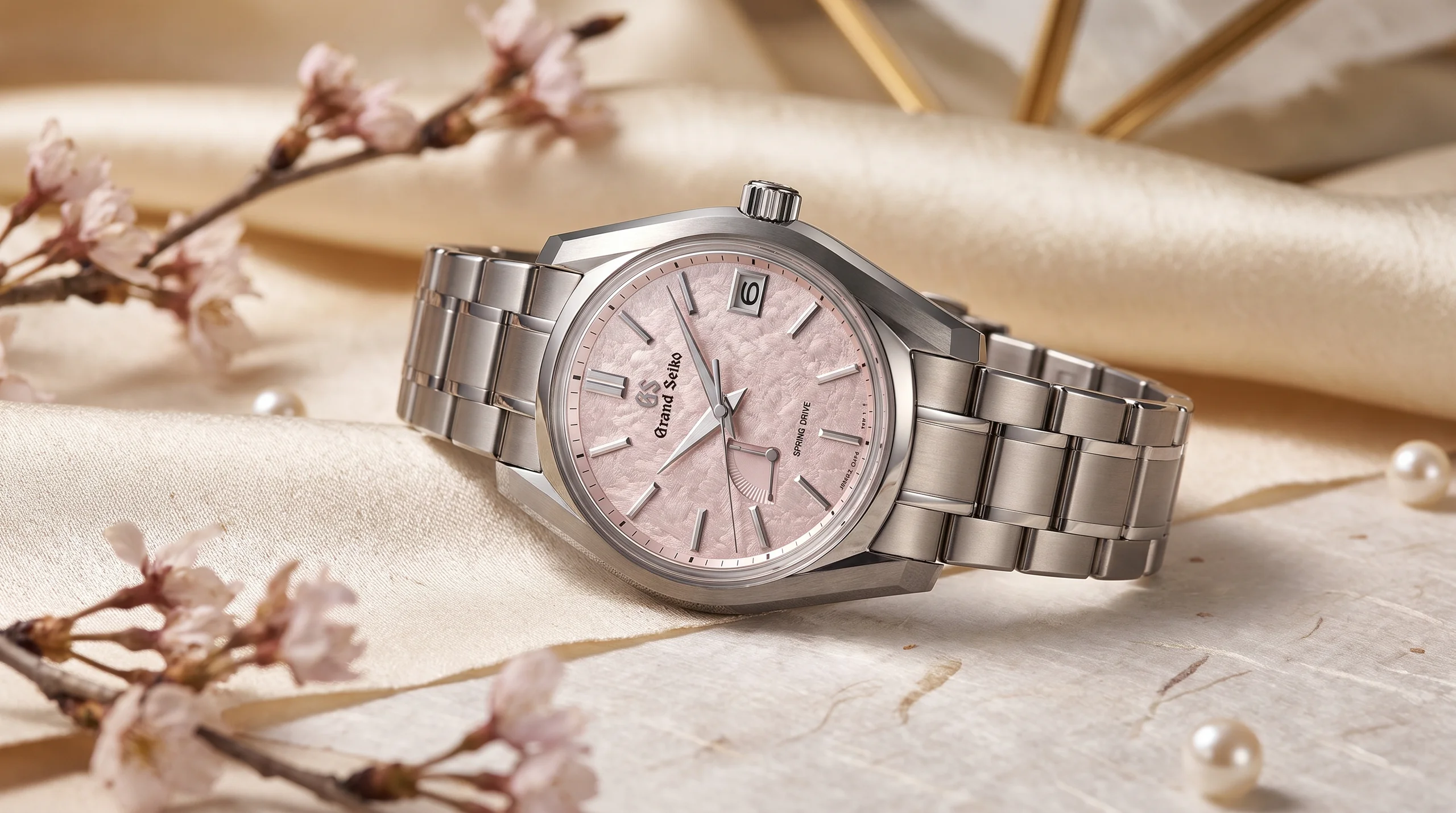Grand Seiko SBGA529 Peach Blossom titanium case and bracelet, boutique exclusive editorial photo