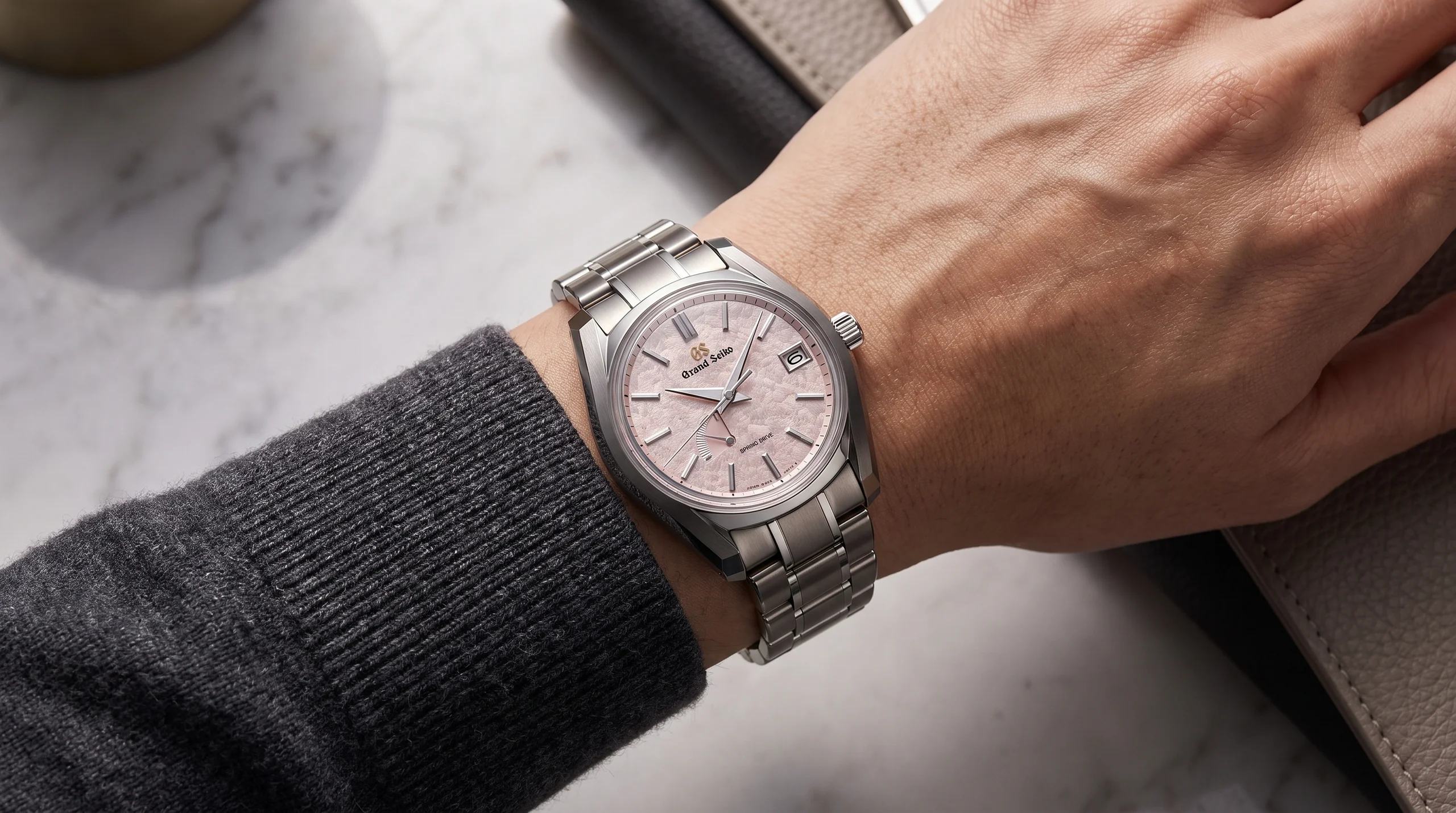 Grand Seiko SBGA529 Peach Blossom on the wrist, titanium case, soft pink frosted dial