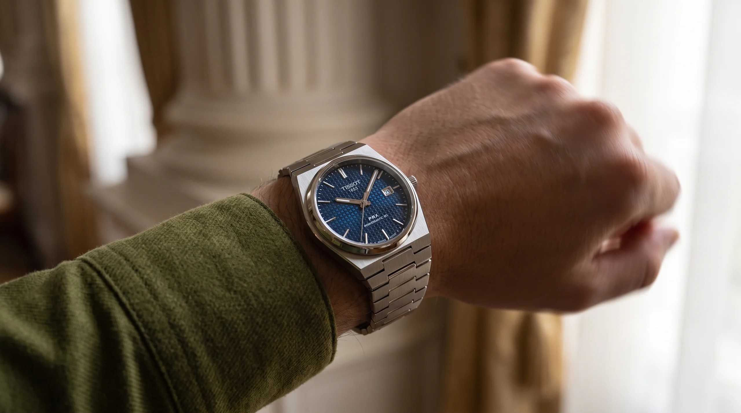 Automatic Tissot PRX on the wrist, self-winding through wrist motion