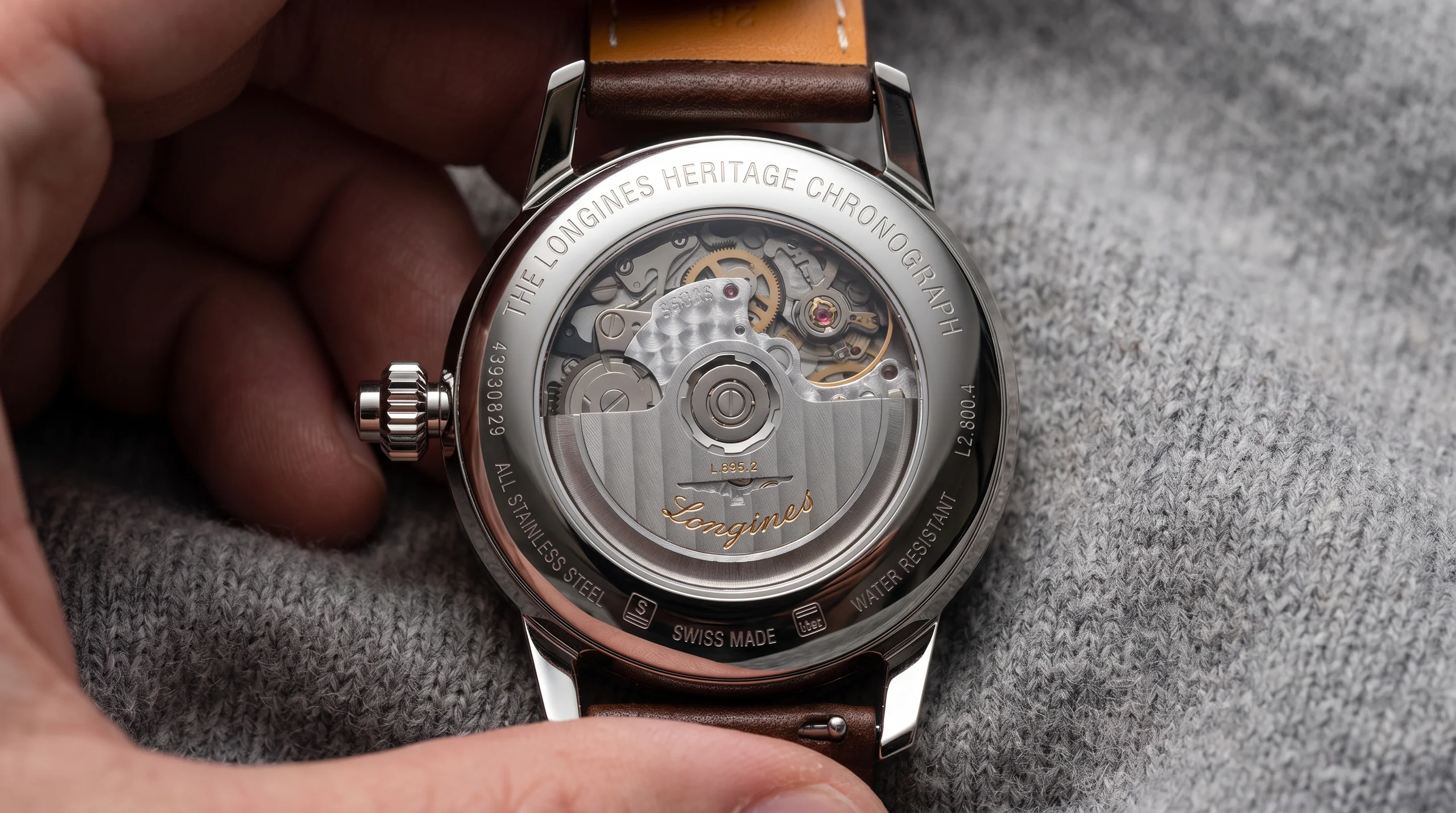 Longines Column-Wheel Single Push-Piece Chronograph caseback editorial image showing the exhibition case back and movement finishing