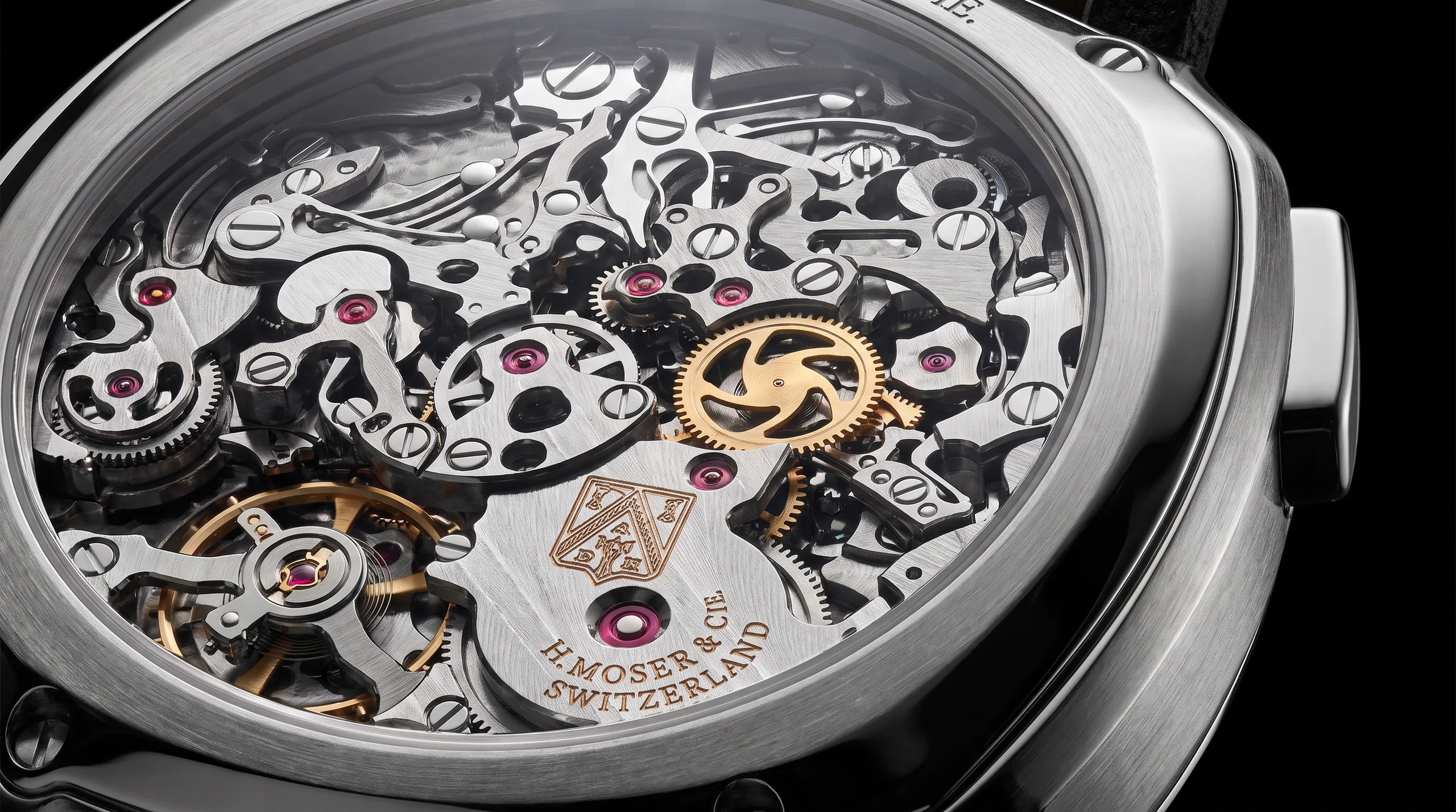 Macro of the H. Moser and Cie Streamliner Flyback Chronograph HMC 907 AgenGraphe movement through the display caseback