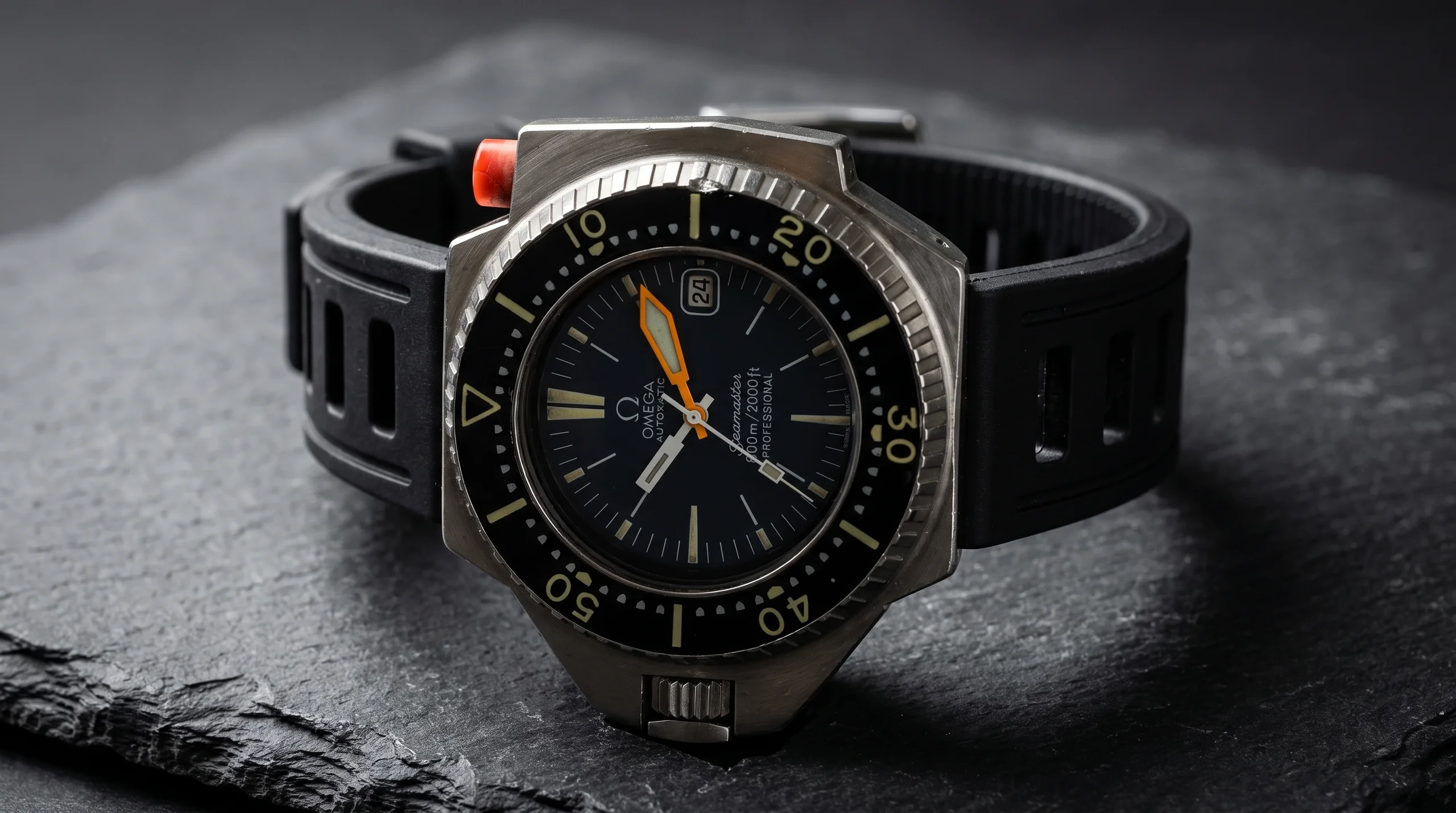 Vintage Omega Seamaster 600 PloProf with asymmetrical monobloc case and orange bezel-lock pusher