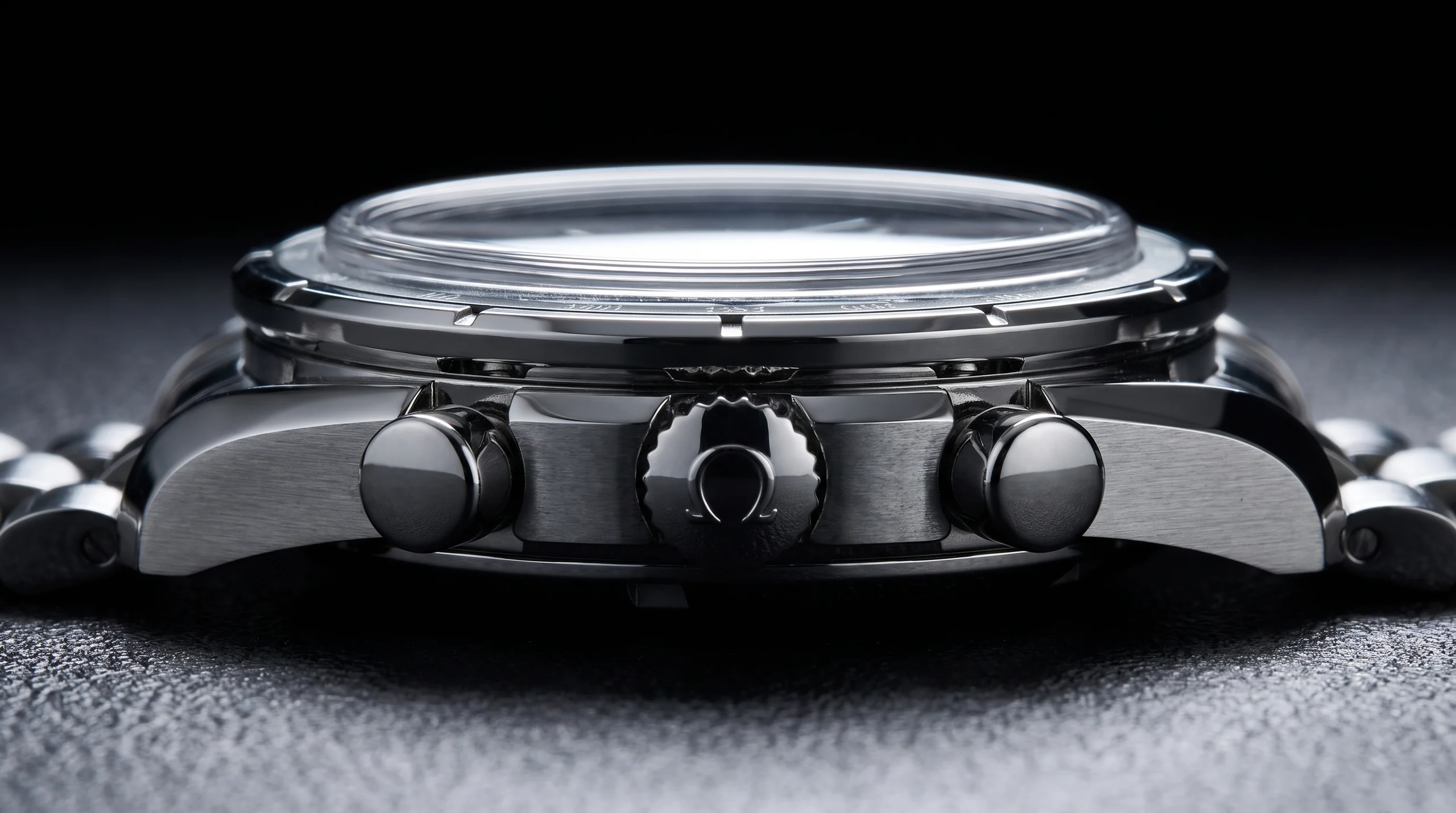Case profile of the Omega Speedmaster 38mm 2026 showing the chronograph pushers and box sapphire crystal