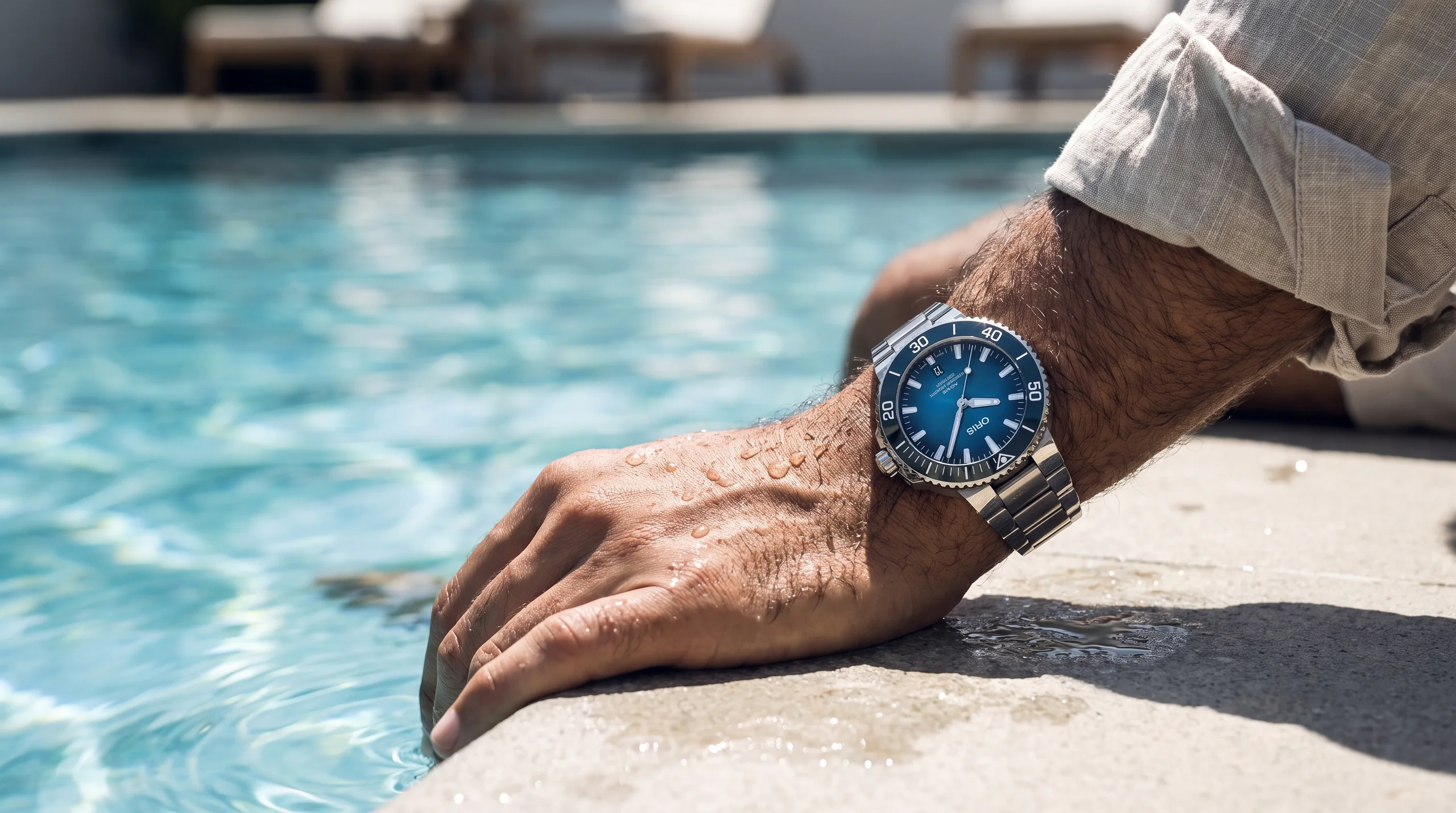 Oris Aquis Date Calibre 400 worn on the wrist poolside, showing its everyday diver proportions