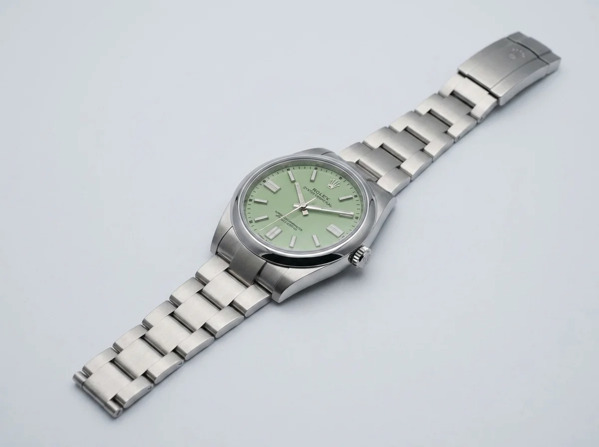 Rolex Oyster Perpetual 41 ref 134300 pistachio green dial, three-quarter studio view showing Oystersteel case and Oyster bracelet