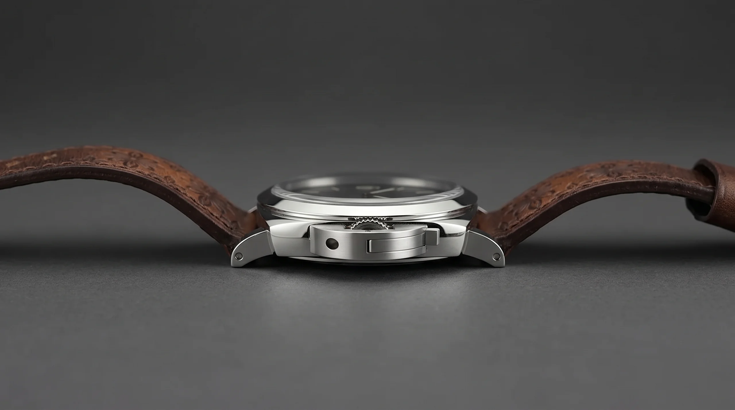 Panerai Luminor Firenze 8 Giorni case side profile showing the single crown, lever-locking crown-protecting bridge, and full dark brown Tuscan calfskin strap