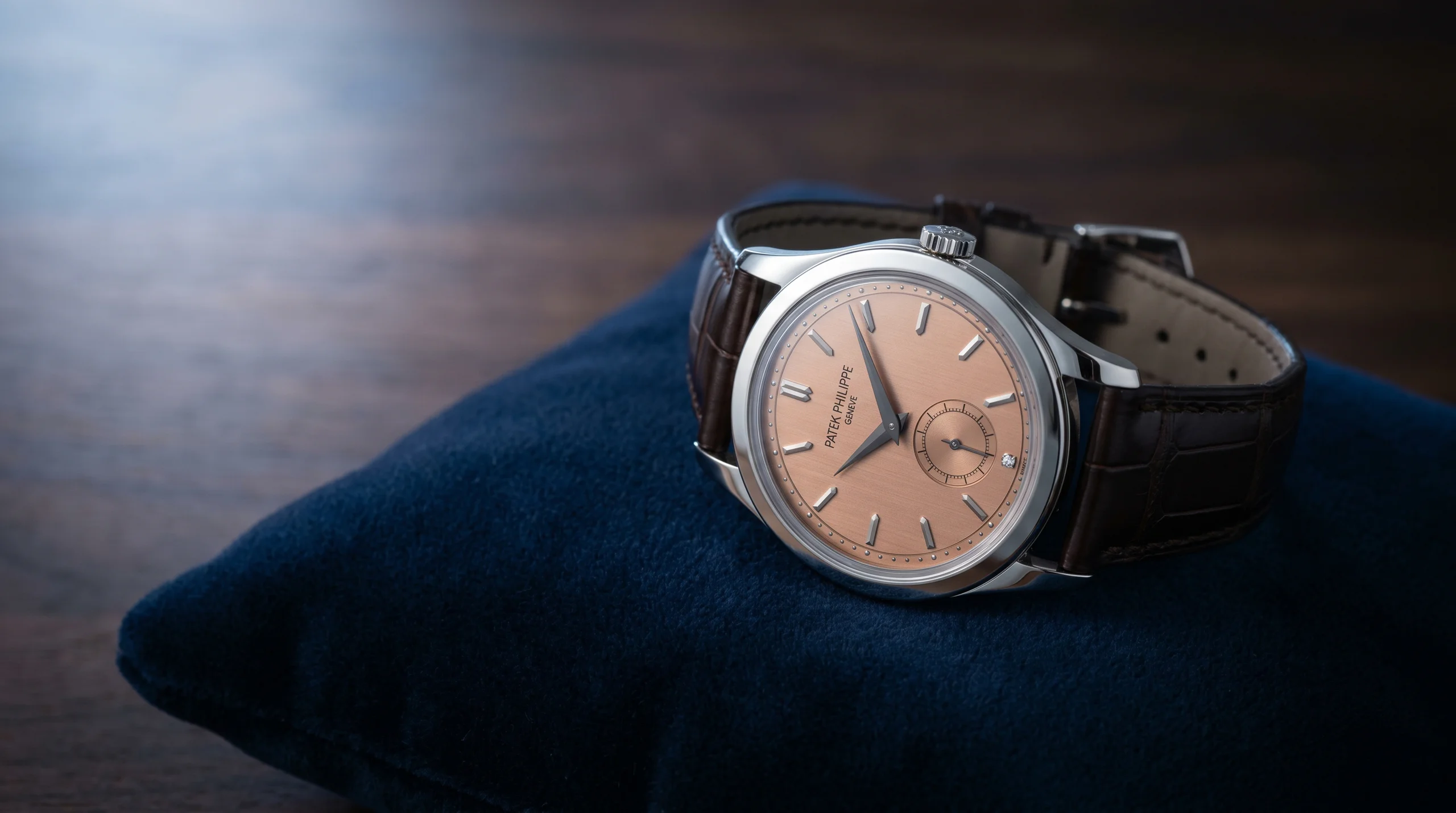 Patek Philippe Calatrava 6196P-001 in 950 platinum with salmon dial and diamond at 6 o'clock, the minimalist time-only flagship