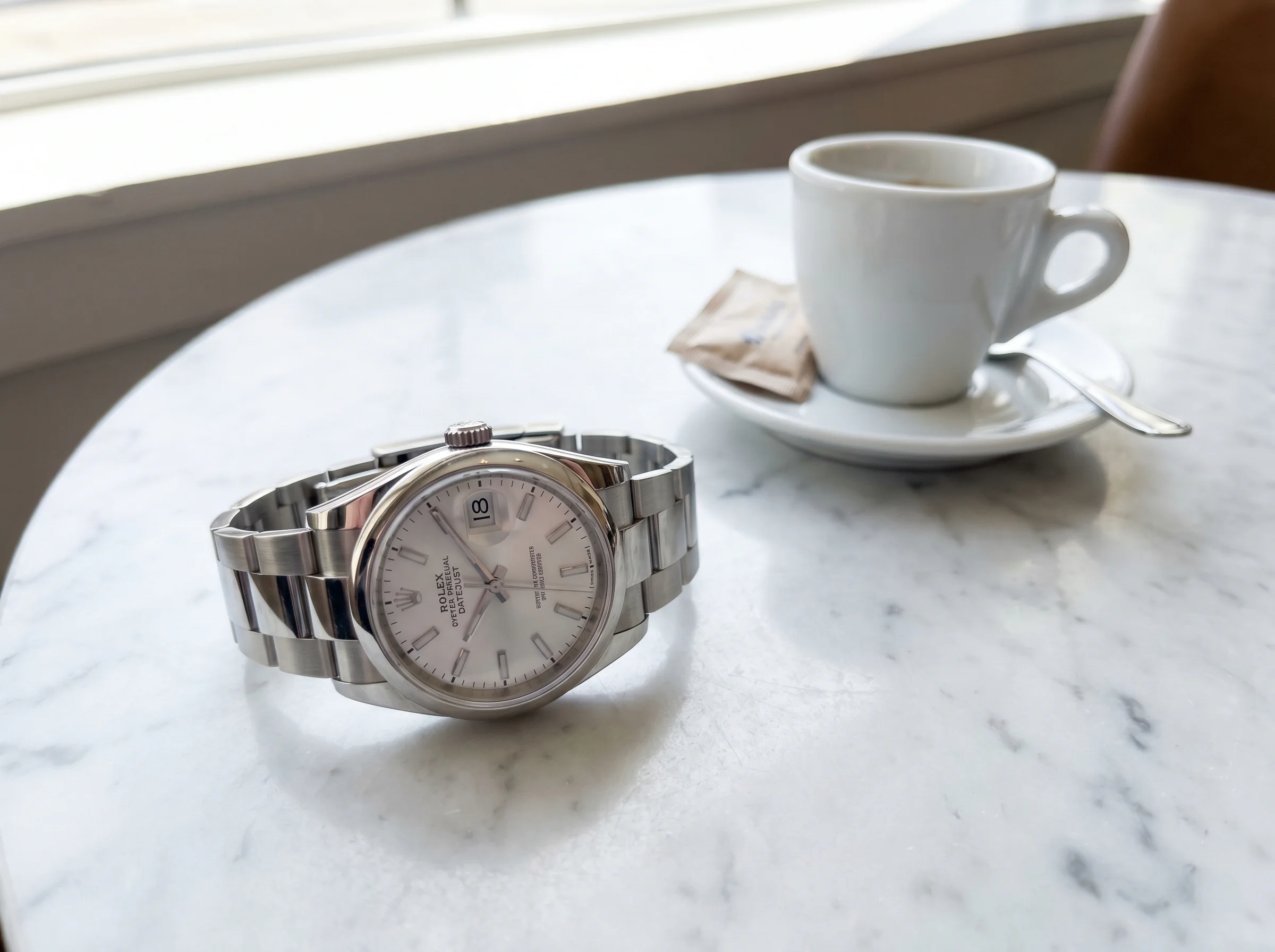 Rolex Datejust 36 reference 126200 in stainless Oystersteel with smooth bezel white dial and Oyster bracelet