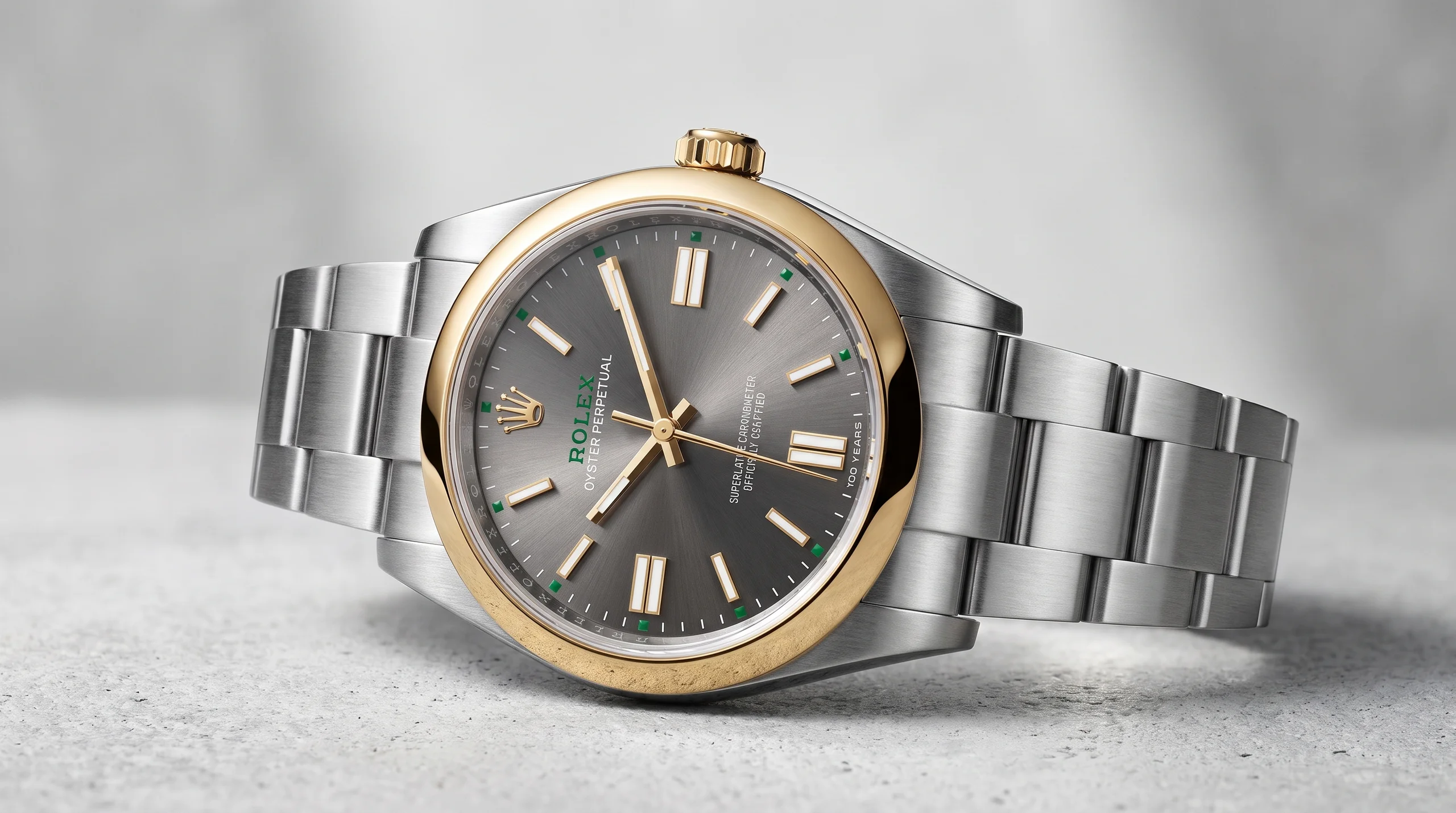 Rolex Oyster Perpetual 100 Years dial close-up showing 100 Years inscription and green accents