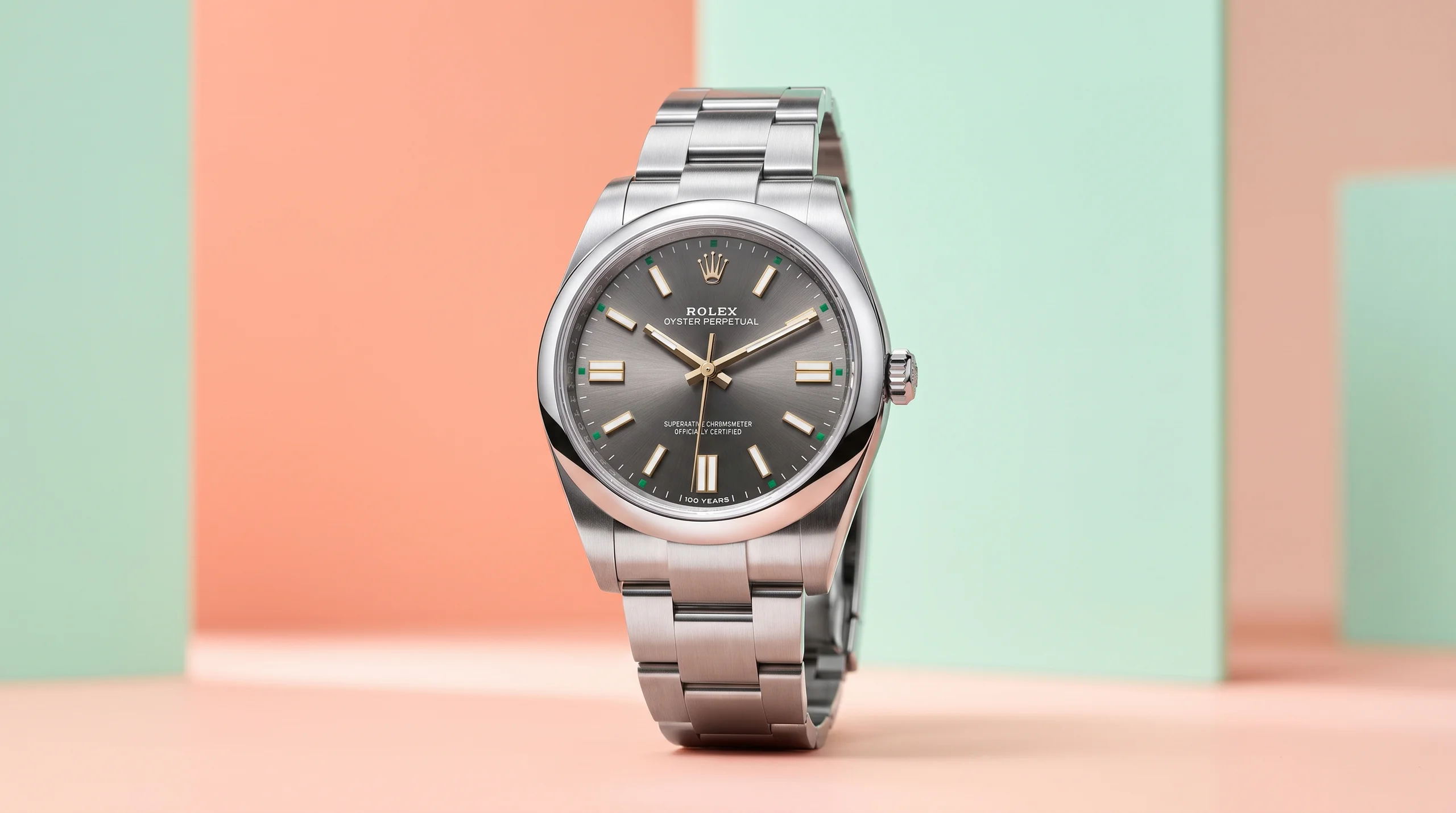 Rolex Oyster Perpetual 41 slate dial against a pastel color-block backdrop