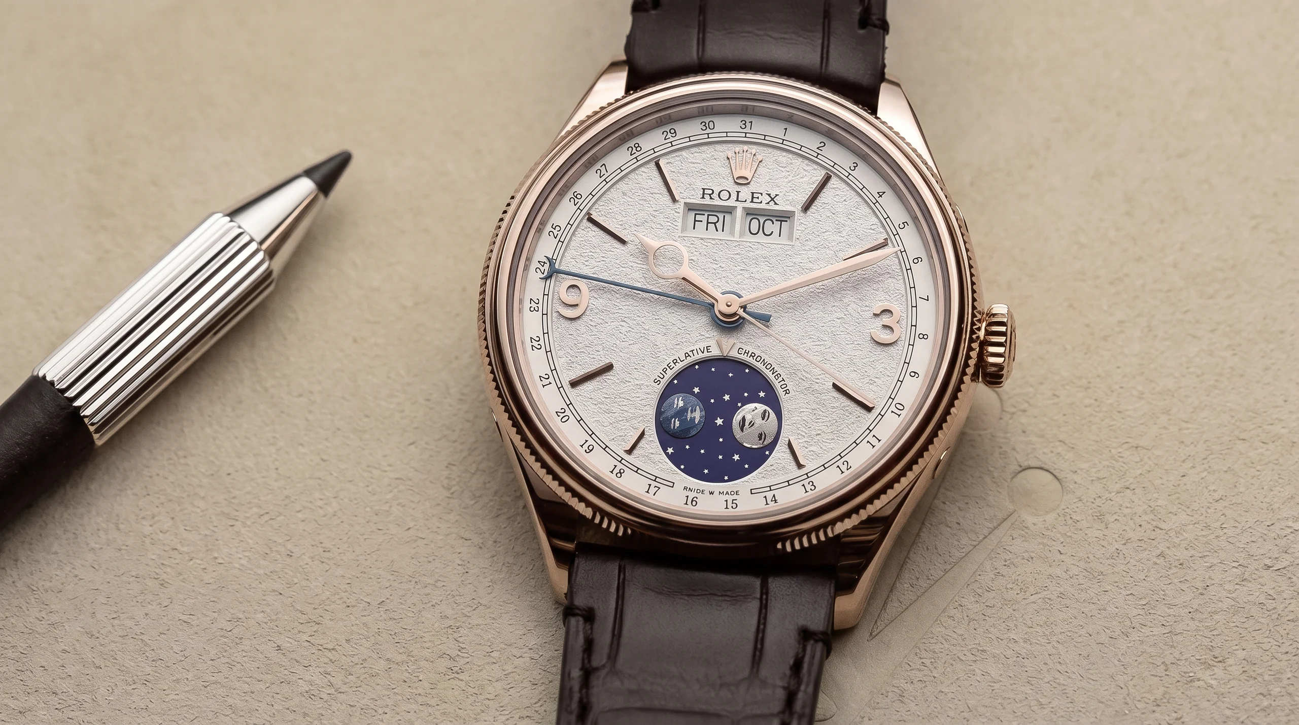 Close-up of the Rolex Perpetual Padellone dial showing the meteorite moonphase display and annual calendar windows