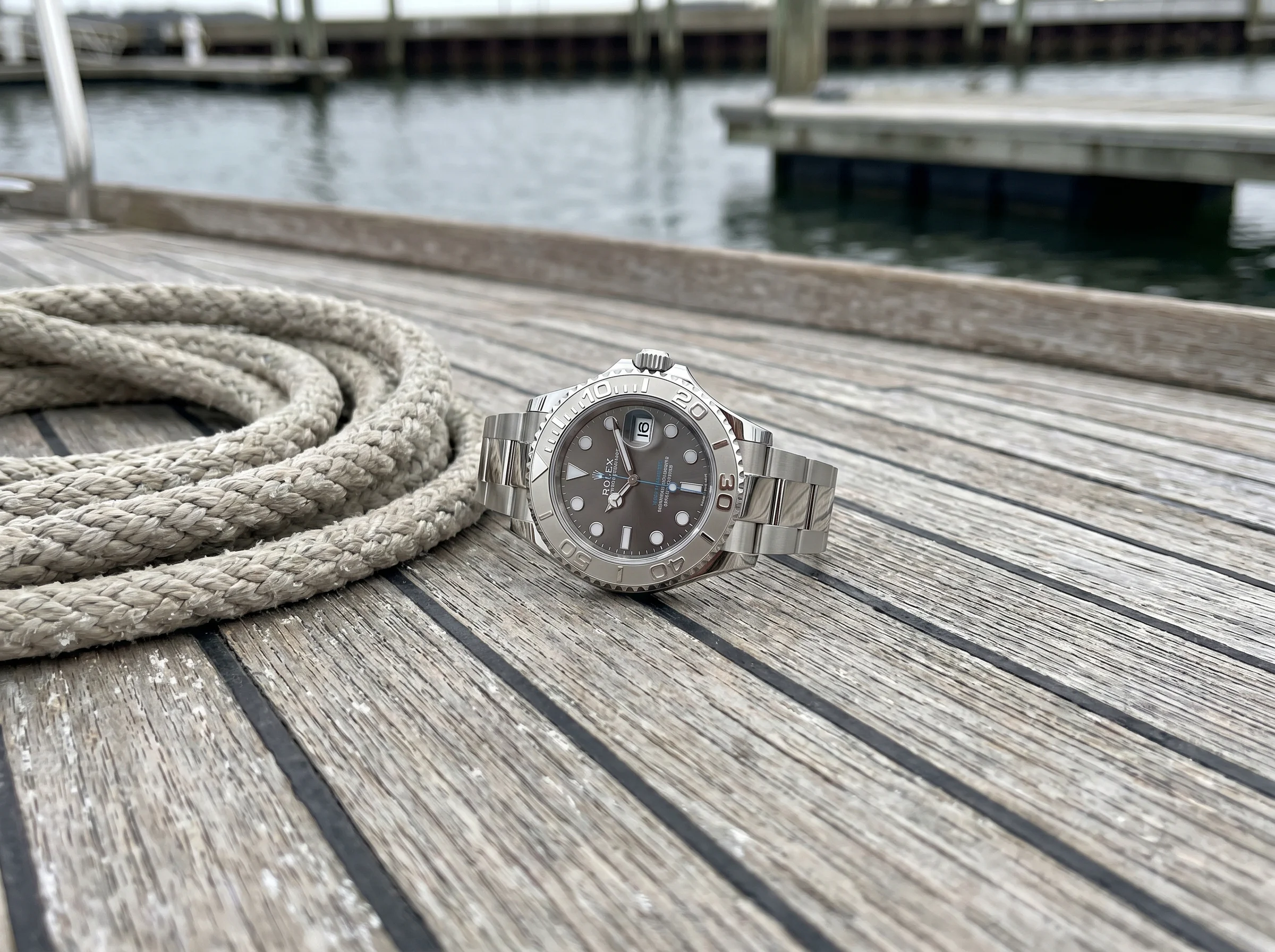 Rolex Yacht-Master 40 126622 with platinum bezel and slate dial on a weathered teak boat deck