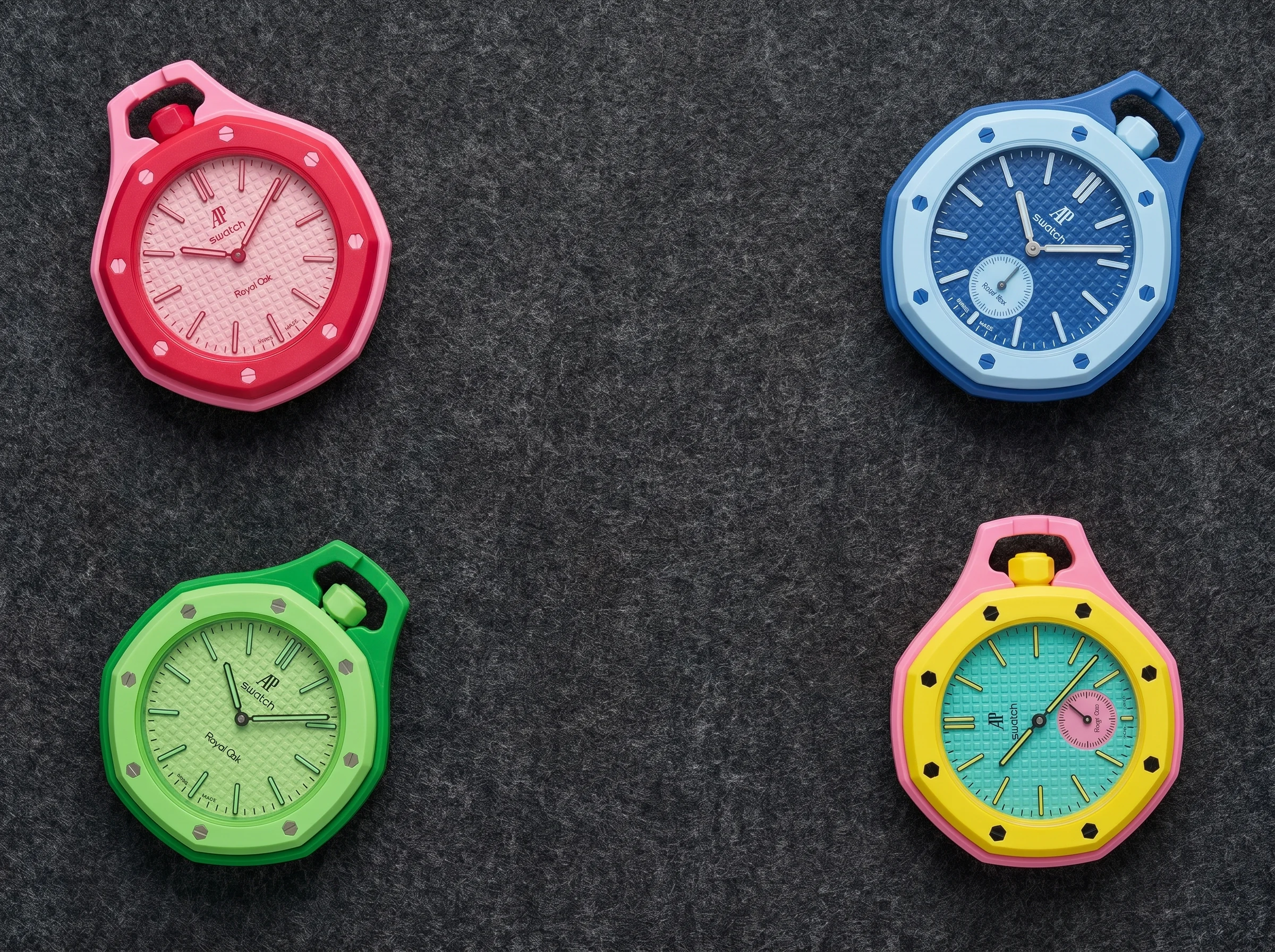 Four AP x Swatch Royal Pop Bioceramic pocket watches in different colorways arranged on charcoal felt flat lay