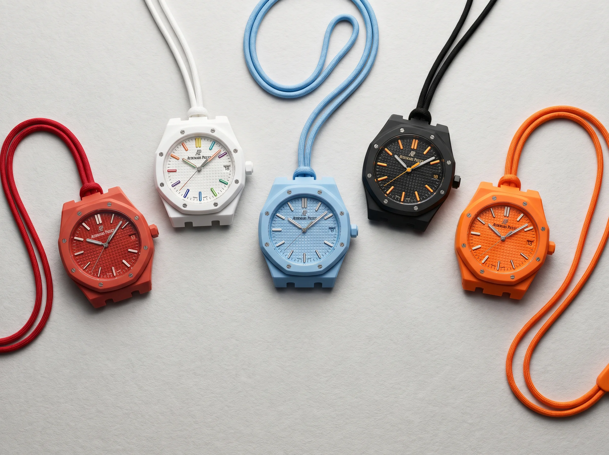Five Swatch x Audemars Piguet Royal Pop bioceramic pocket watches arranged showing the eight-piece collection colorways