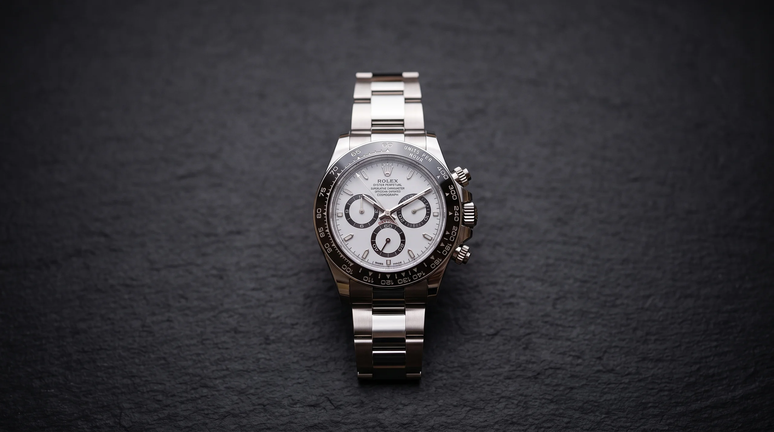 Rolex Cosmograph Daytona 126500LN with white panda dial and black ceramic bezel on slate