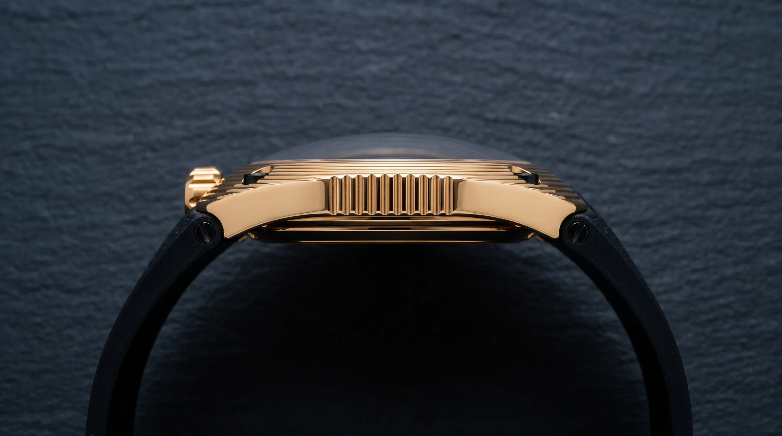 Case side profile of the URWERK UR-150 Golden Scorpion showing the elongated case shape and top-mounted screw-down crown