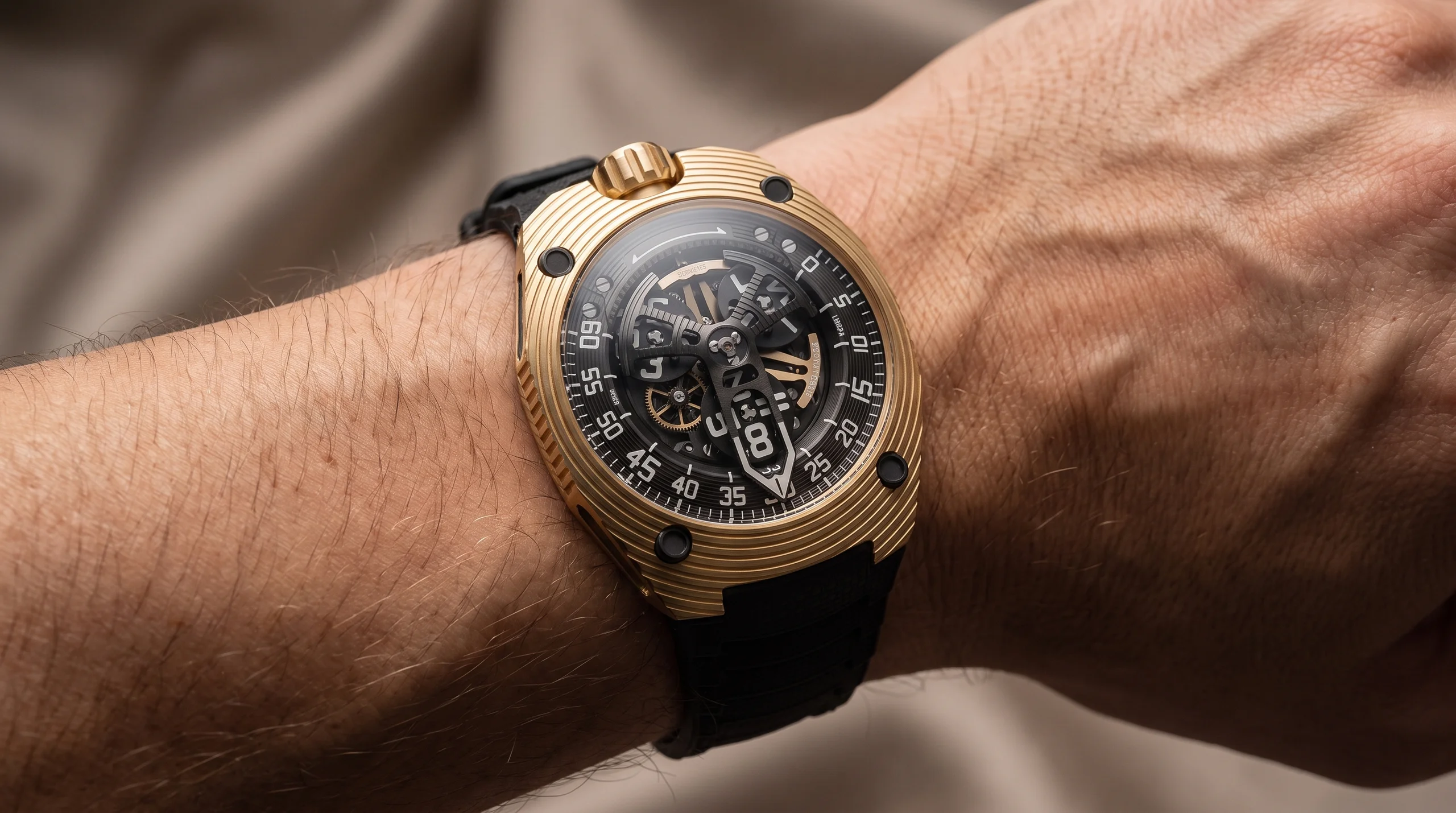 URWERK UR-150 Golden Scorpion watch in 2N yellow gold worn on the wrist, front angle