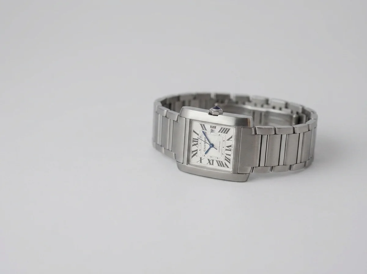 A small rectangular Cartier Tank Francaise in steel, representing a smaller, dressier watch size