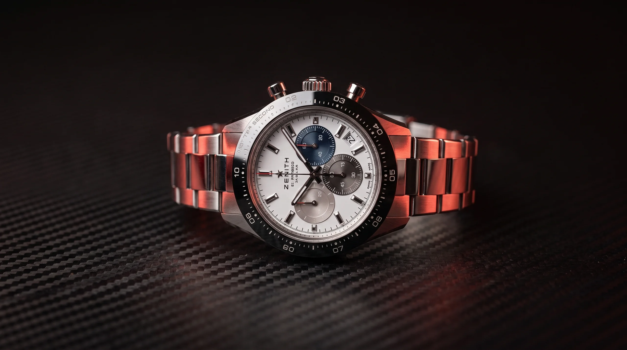 Zenith Chronomaster Sport black dial chronograph on a carbon-fiber surface