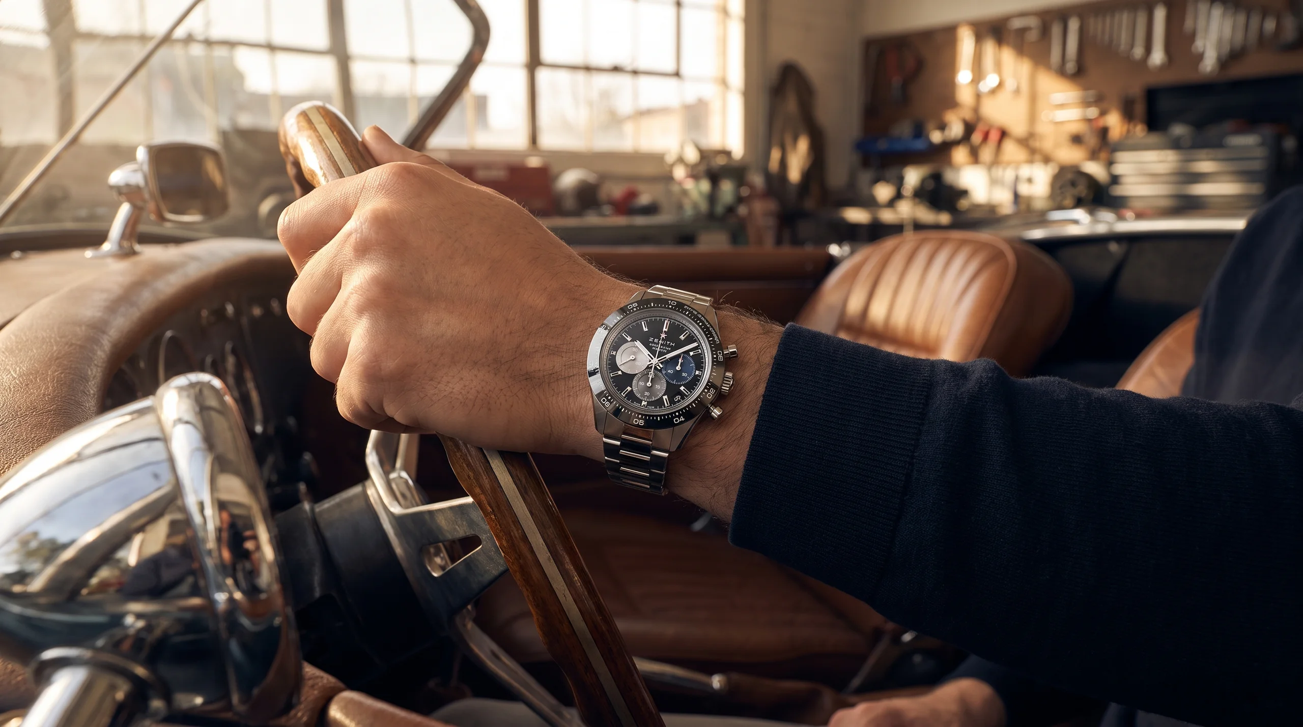 Zenith Chronomaster Sport worn on the wrist at a car steering wheel